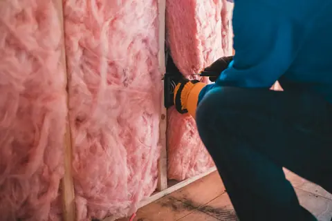 Fiberglass batts installed in a wall